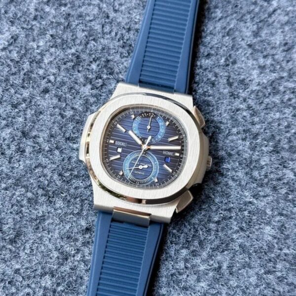 The Patek Philippe Nautilus Time Travel 5990/1A features a stunning blue dial, automatic movement, and a comfortable silicone strap. Perfect for any occasion